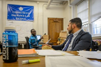 Students study in the office of the Connecticut Law Insurance Journal at the UConn School of Law on May 5, 2016. (Peter Morenus/UConn Photo)