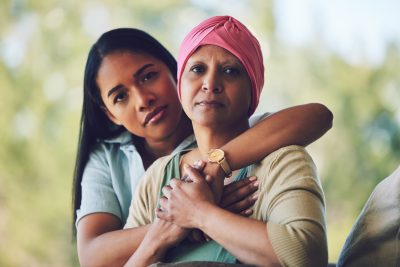 Portrait of mother with cancer, adult daughter in garden and support, love and care in family relationship. 