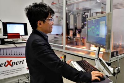 A man using a computer to work on a project