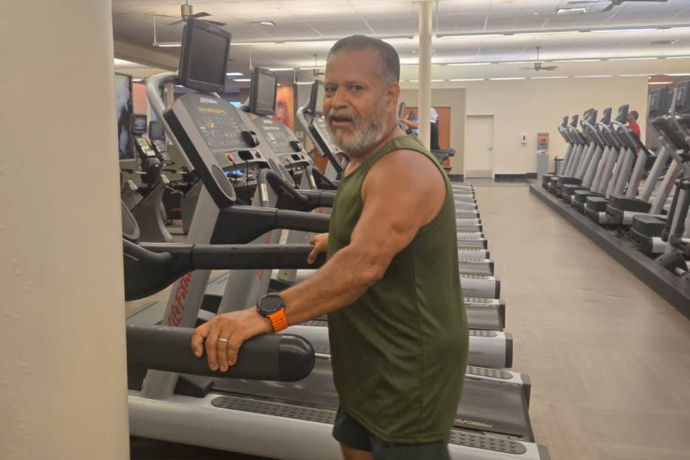 elderly man on a treadmill at a gym