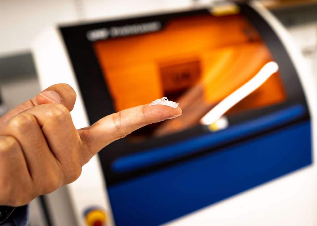 technological device displayed on a person's finger
